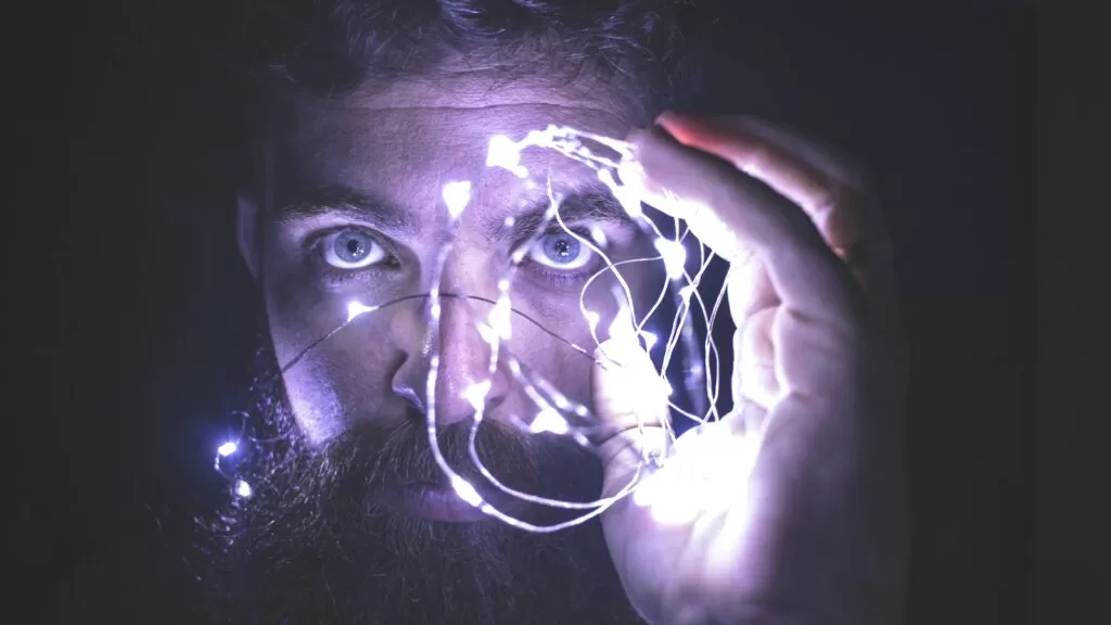 Person Holding String brain Lights Photo